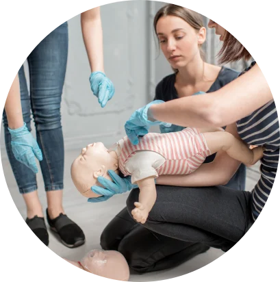 Hands-on paediatric first aid practice with an infant mannequin